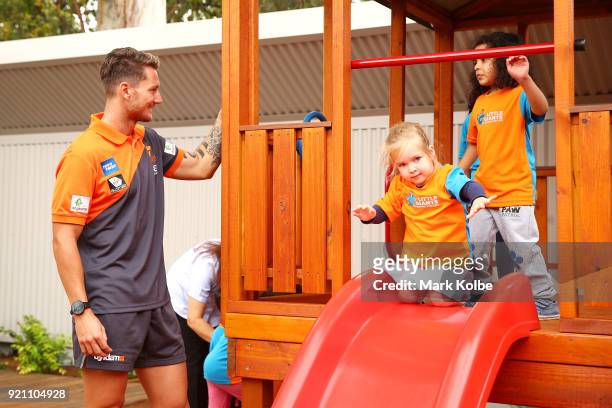 Daniel Lloyd interacts with children during a Greater Western Sydney Giants AFL media opportunity to launch their ÔLittle GIANTSÔ early education...