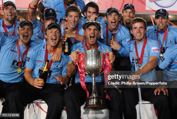 Sussex captain Mike Yardy holds the trophy as his team celebrate winning the Twenty20 Cup Final between Somerset and Sussex by 63 runs at Edgbaston,...