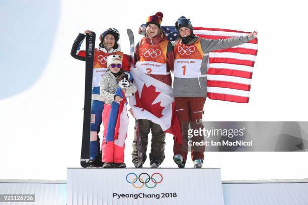 Marie Martinod of France, her daughter Melirose, Cassie Sharpe of Canada and Brita Sigourney stand on the podium after the Women's Halfpipe final at...