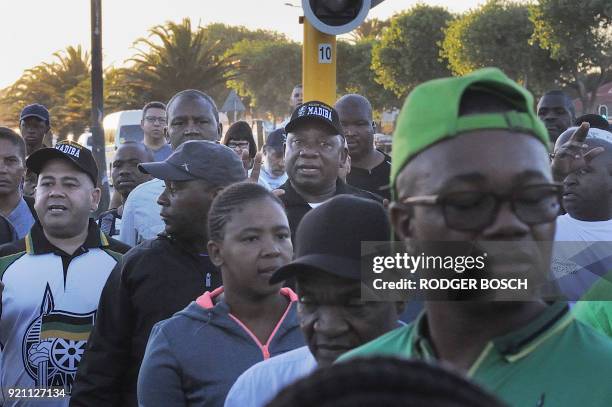 New South African President Cyril Ramaphosa Cyril Ramaphosa , flanked by members of the media and a group of other people, walk from Guguletu...