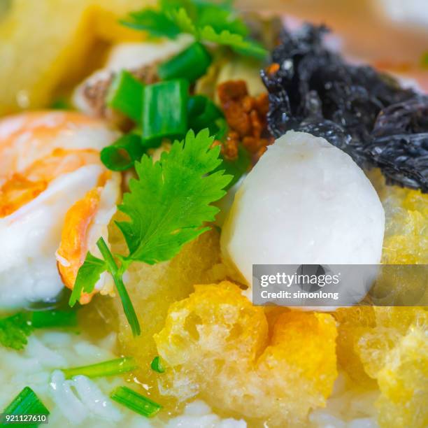 close up view of rice soup with shrimp & fish ball - fishball stock-fotos und bilder