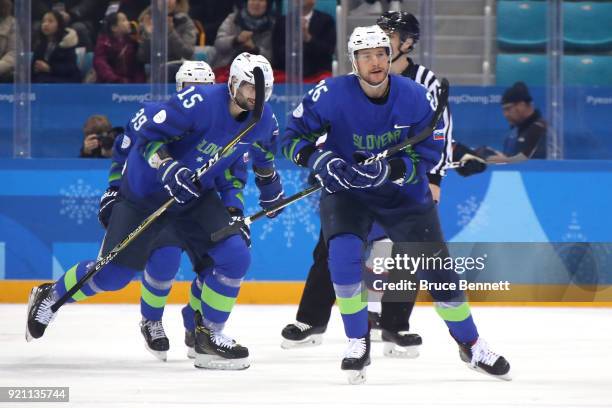 Jan Urbas of Slovenia celebrates with his teammates after scoring a goal against Lars Haugen of Norway in the first period during the Men's Play-offs...