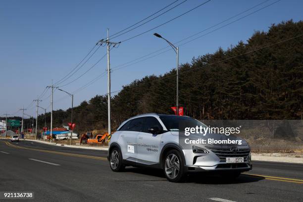 Hyundai Motor Co. Nexo autonomous fuel cell electric vehicle travels along a road during a test drive in Pyeongchang, Gangwon Province, South Korea,...