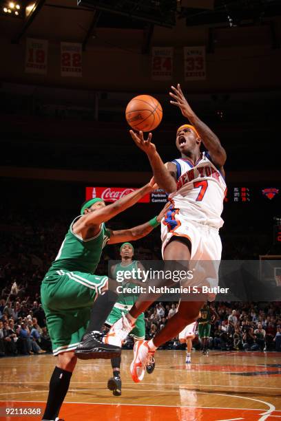 Al Harrington of the New York Knicks shoots against Eddie House of the Boston Celtics on October 20, 2009 at Madison Square Garden in New York City....