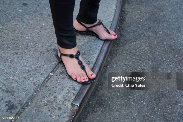 woman in sandals - black painted toes stock-fotos und bilder