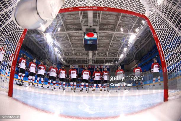 Japan line up in front of the goal before the start of their game against Switzerland during the Women's Ice Hockey Classification game on day eleven...