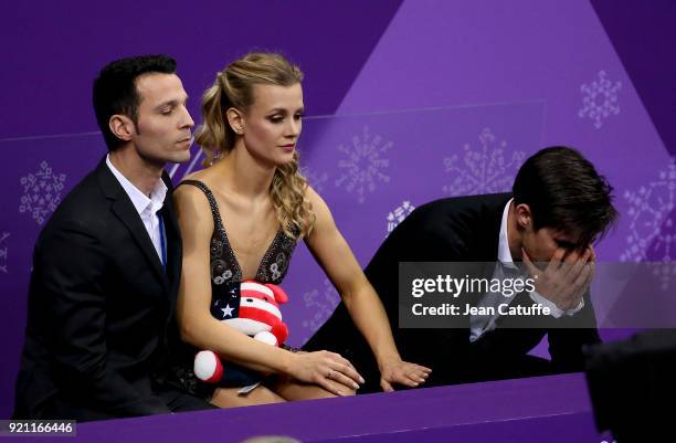 Madison Hubell and Zachary Donohue of USA with their coach Romain Hagenauer react with disappointment at 'kiss and cry' during the Figure Skating Ice...