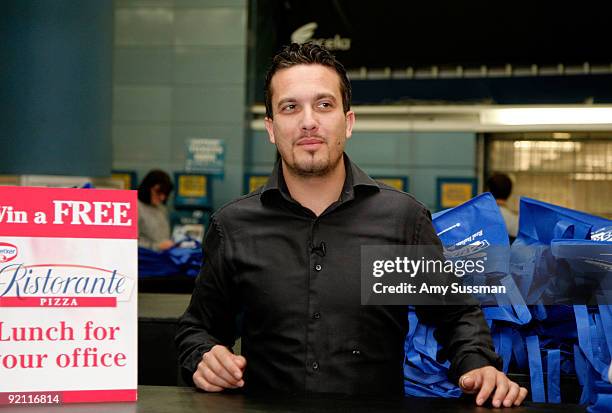 Top Chef's Fabio Viviani gives away Dr. Oetker Ristorante pizza at Penn Station on October 20, 2009 in New York City.