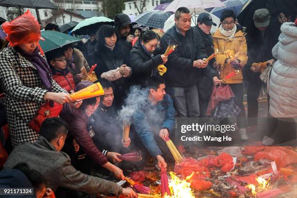 People worship the God of Fortune at the Guiyuan Temple on February 20, 2018 in Wuhan, Hubei province, China. The fifth day in the lunar new year is...