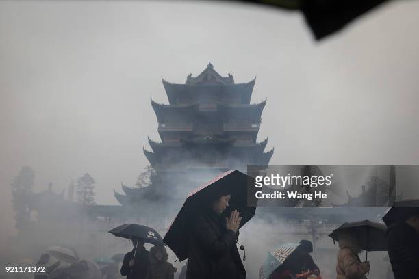 Women worships the God of Fortune at the Guiyuan Temple on February 20, 2018 in Wuhan, Hubei province, China. The fifth day in the lunar new year is...