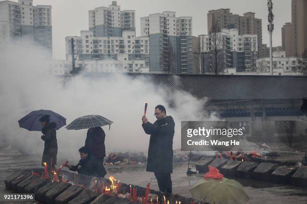 People worship the God of Fortune at the Guiyuan Temple on February 20, 2018 in Wuhan, Hubei province, China. The fifth day in the lunar new year is...