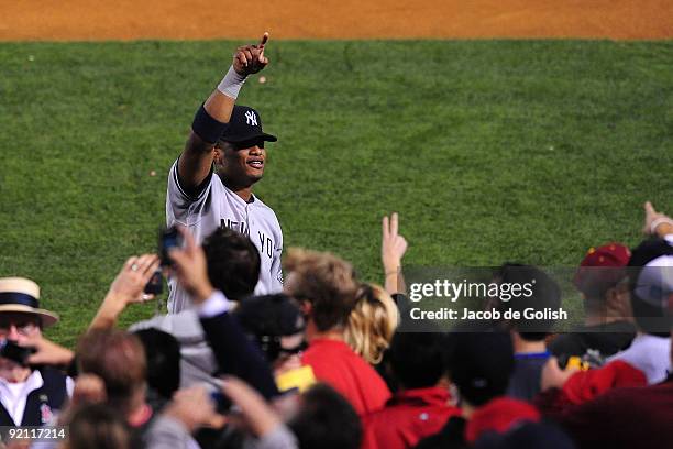 Robinson Cano of the New York Yankees celebrates after defeating the Los Angeles Angels of Anaheim 10-1 in Game Four of the ALCS during the 2009 MLB...