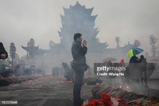 Man worships the God of Fortune at the Guiyuan Temple on February 20, 2018 in Wuhan, Hubei province, China. The fifth day in the lunar new year is...