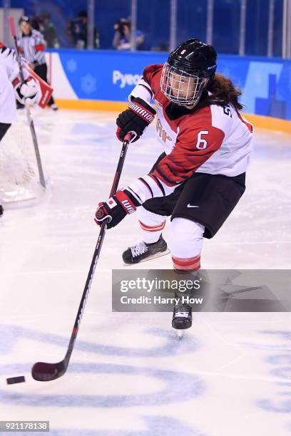 Sena Suzuki of Japan controls the puck in the third period against Switzerland during the Women's Ice Hockey Classification game on day eleven of the...