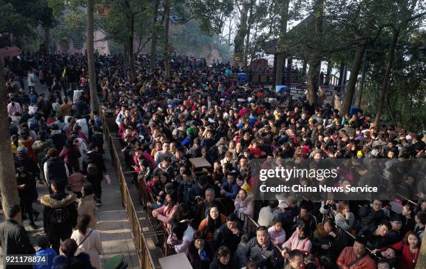 Tourists visit the Leshan Giant Buddha on February 20, 2018 in Leshan, Sichuan Province of China. Thousands of tourists waited about four hours to...