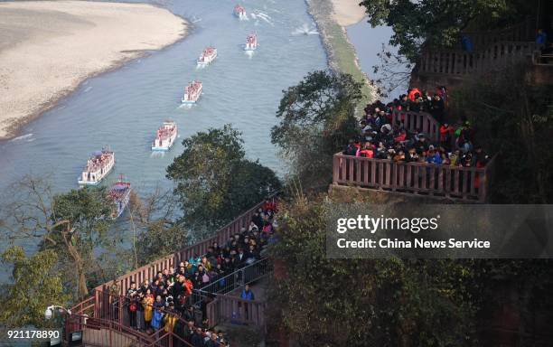 Tourists visit the Leshan Giant Buddha on February 20, 2018 in Leshan, Sichuan Province of China. Thousands of tourists waited about four hours to...