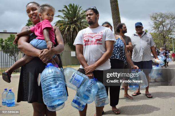 People wait in line for water in Cape Town on Feb. 16, 2018. In June, the South African city is expected to become the first major world city to...