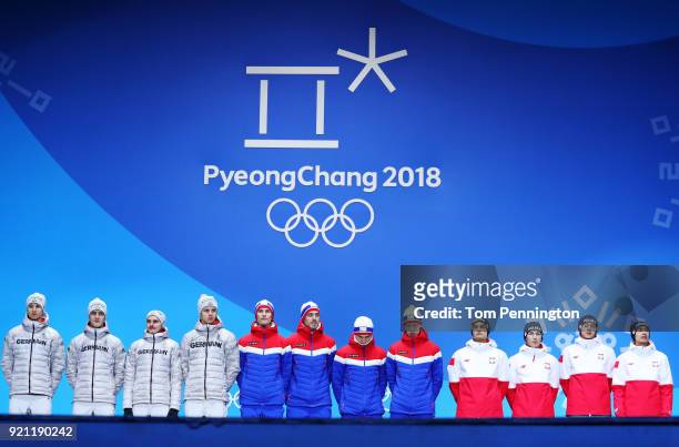 Silver medalists Karl Geiger, Stephan Leyhe, Richard Freitag and Andreas Wellinger of Germany, gold medalists Daniel Andre Tande, Andreas St Jernen,...