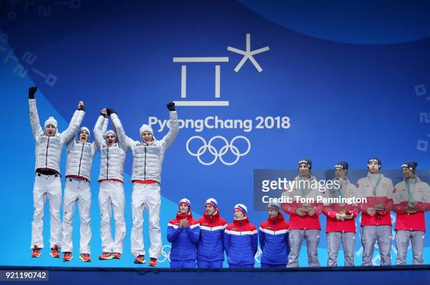 Silver medalists Karl Geiger, Stephan Leyhe, Richard Freitag and Andreas Wellinger of Germany, gold medalists Daniel Andre Tande, Andreas St Jernen,...