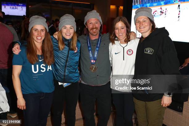 Olympians Maddie Bowman, Annalisa Drew, Coach Ben Verge, and U.S. Olympians Brita Sigourney and Devon Logan pose for a photo at the USA House at the...