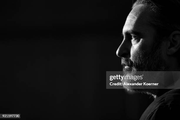 Joaquin Phoenix poses at the 'Don't Worry, He Won't Get Far on Foot' photo call during the 68th Berlinale International Film Festival Berlin at Grand...