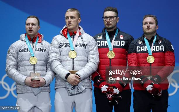 Gold medalists Francesco Friedrich and Thorsten Margis of Germany and gold medalists Alexander Kopacz and Justin Kripps of Canada stand on the podium...