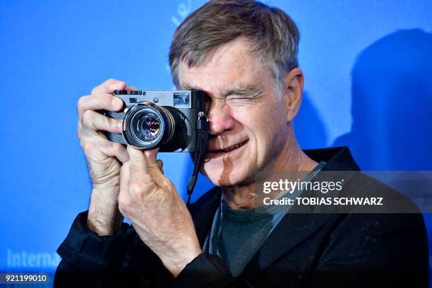 Director Gus Van Sant takes a picture as he poses during the photo call for the film "Don't Worry, He Won't Get Far on Foot" in competition during...