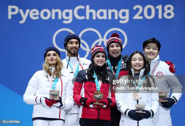 Silver medalists Gabriella Papadakis and Guillaume Cizeron of France, gold medalists Tessa Virtue and Scott Moir of Canada and bronze medalists Maia...