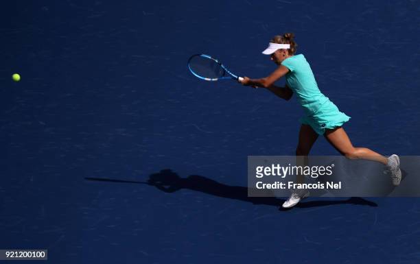 Elise Mertens of Belguim in action against Catherine Bellis of USA during day two of the WTA Dubai Duty Free Tennis Championship at the Dubai Tennis...