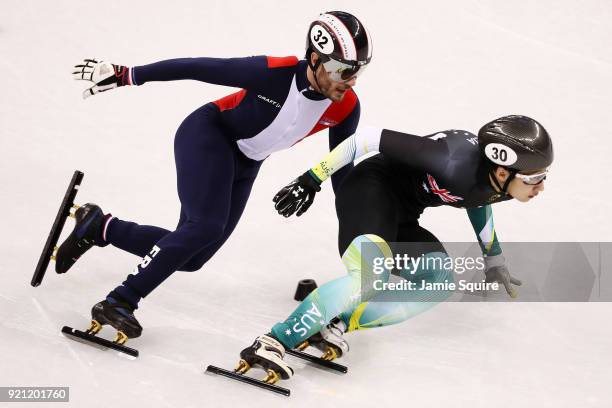 Thibaut Fauconnet of France and Andy Jung of Australia compete during the Men's Short Track Speed Skating 500m Heats on day eleven of the PyeongChang...
