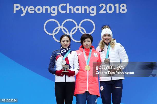 Silver medalist Sang-Hwa Lee of Korea, gold medalist Nao Kodaira of Japan and bronze medalist Karolina Erbanova of the Czech Republic celebrate...