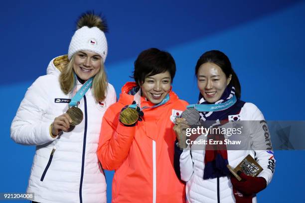 Bronze medalist Karolina Erbanova of the Czech Republic, gold medalist Nao Kodaira of Japan and silver medalist Sang-Hwa Lee of Korea celebrate...