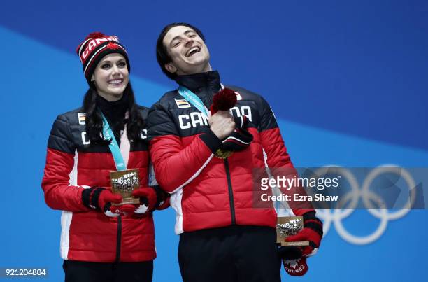 Gold medalists Tessa Virtue and Scott Moir of Canada celebrate during the medal ceremony for Figure Skating - Ice Dance Free Dance on day 11 of the...