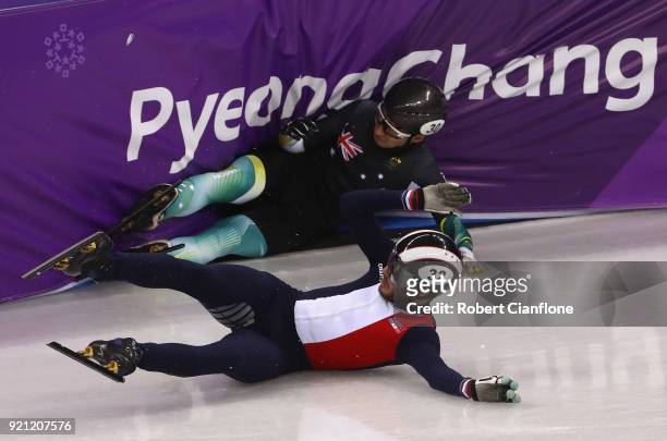 Thibaut Fauconnet of France and Andy Jung of Australia crash out during the Men's Short Track Speed Skating 500m Heats on day eleven of the...