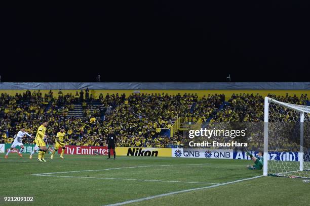 Zhang Lu of Tianjin Quanjian saves the penalty kick by Cristiano of Kashiwa Reysol during the AFC Champions League match between Kashiwa Reysol and...