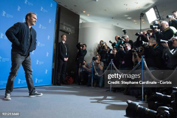 Joaquin Phoenix poses at the 'Don't Worry, He Won't Get Far on Foot' photo call during the 68th Berlinale International Film Festival Berlin at Grand...