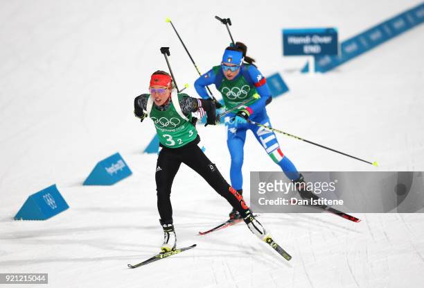 Laura Dahlmeier of Germany and Dorothea Wierer of Italy compete during the Biathlon 2x6km Women + 2x7.5km Men Mixed Relay on day 11 of the...