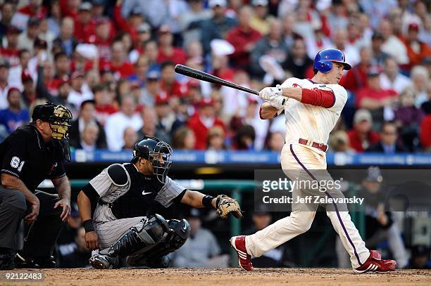 Chase Utley of the Philadelphia Phillies singles in the bottom of the sixth inning against the Colorado Rockies in Game Two of the NLDS during the...