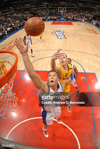 Blake Griffin of the Los Angeles Clippers reaches for a rebound against Maciej Lampe of Maccabi Electra Tel Aviv at Staples Center on October 20,...