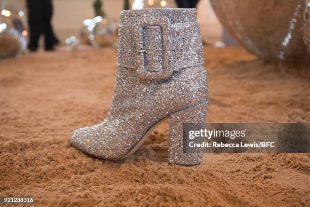 Model, shoe detail, poses at the Alexander White presentation during London Fashion Week February 2018 on February 20, 2018 in London, England.