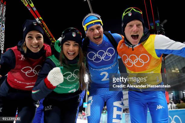 Lisa Vittozzi, Dorothea Wierery, Dominik Windisch and Lukas Hofer of Italy celebrate after winning the bronze medal during the Biathlon 2x6km Women +...