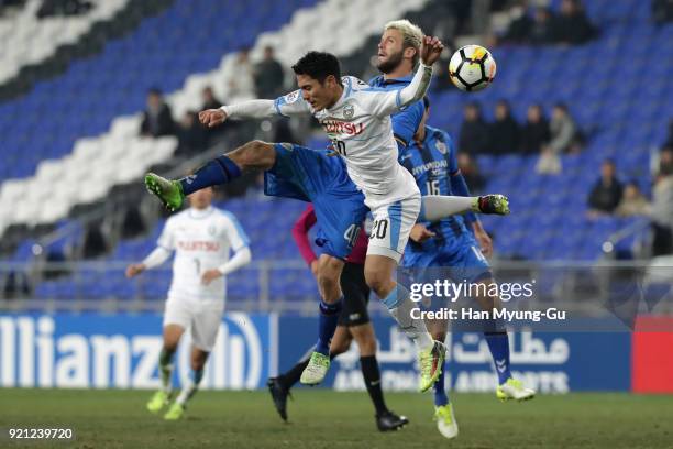Kei Chinen of Kawasaki Frontale and Richard Windbichler of Ulsan Hyndai compete for the ball during the AFC Champions League Group F match between...