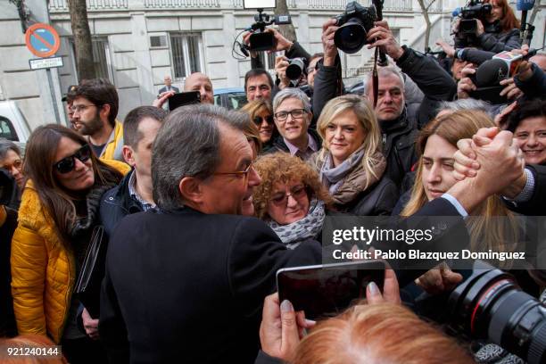 Former President of the Generalitat of Catalonia Artur Mas shake hands with supporters as he leaves the Supreme Court on February 20, 2018 in Madrid,...