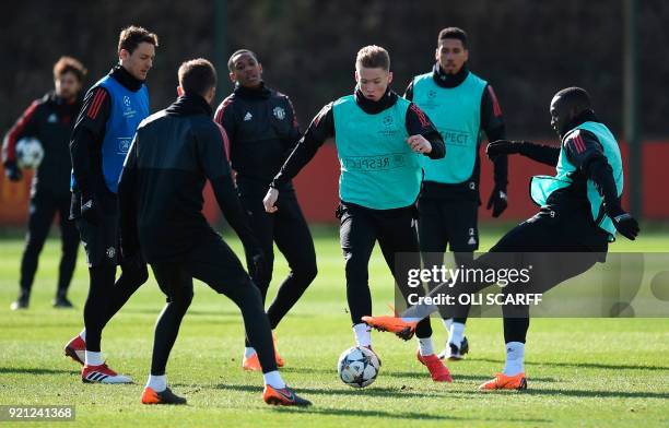 Manchester United's English midfielder Scott McTominay and Manchester United's Belgian striker Romelu Lukaku take part in a team training session at...