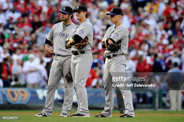 Ian Stewart, Troy Tulowitzki and Clint Barmes of the Colorado Rockies look on during a pitching change against the Philadelphia Phillies in Game Two...