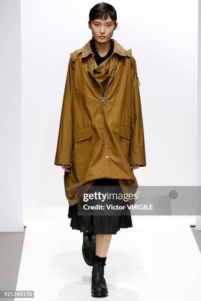 Model walks the runway at the Margaret Howell Ready to Wear Fall/Winter 2018-2019 fashion show during London Fashion Week February 2018 on February...