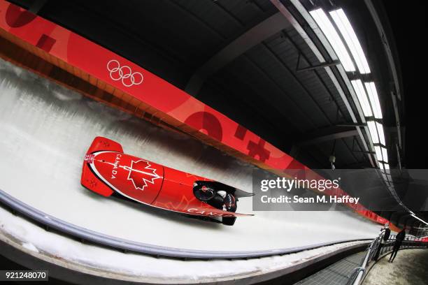 Christine de Bruin and Melissa Lotholz of Canada slide during the Women's Bobsleigh heats at the Olympic Sliding Centre on day eleven of the...