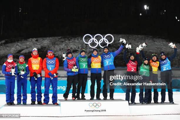 Silver medalists Marte Olsbu, Tiril Eckhoff, Johannes Thingnes Boe and Emil Hegle Svendsen of Norway, gold medalists Marie Dorin Habert, Anais...