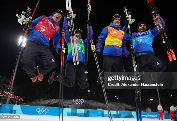 Gold medalists Marie Dorin Habert, Anais Bescond, Simon Desthieux and Martin Fourcade of France celebrate during the victory ceremony after the...