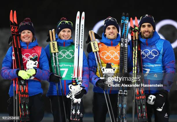 Gold medalists Marie Dorin Habert, Anais Bescond, Simon Desthieux and Martin Fourcade of France celebrate during the victory ceremony after the...